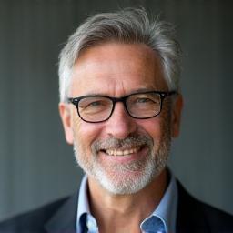 Headshot of Jean-Pierre Dubois, Master Woodworker.